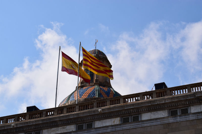 Catalonian & Spanish flags flying side-by-side