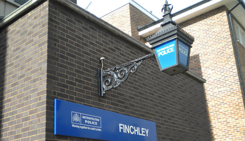 Image of police sign, outside Finchley station, UK