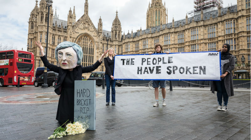 Image of three protesters outside Westminster 