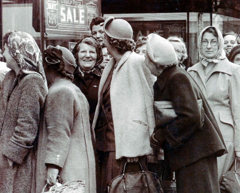 Shoppers queue in 1950s Bristol