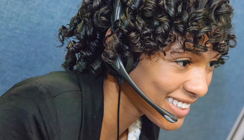 Smiling woman in call centre