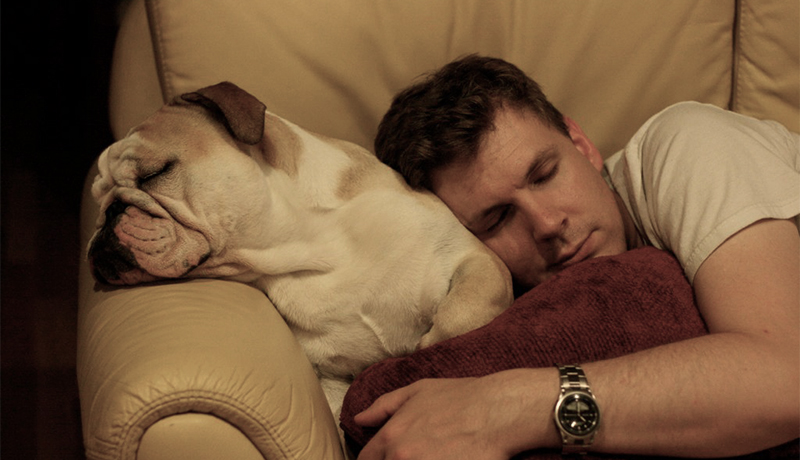Man and dog sleeping 