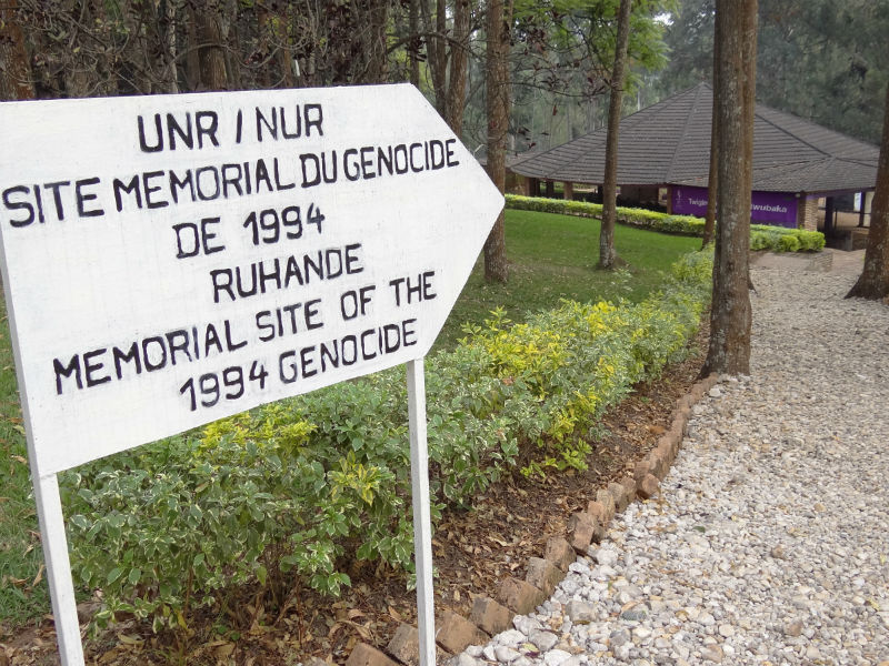 Sign pointing to a memorial of the Rwandan genocide