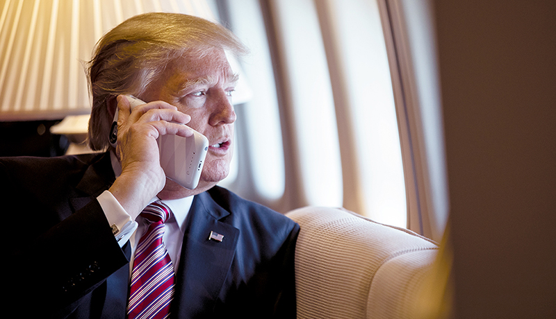 Donald Trump using his phone