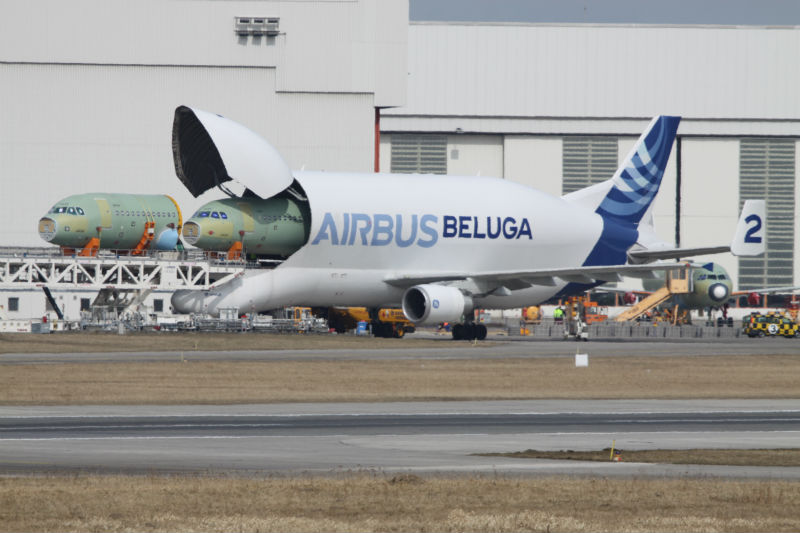 Airbus Beluga being loaded with smaller aircraft fuselage
