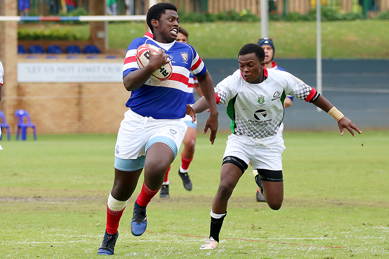 two black young men playing rugby
