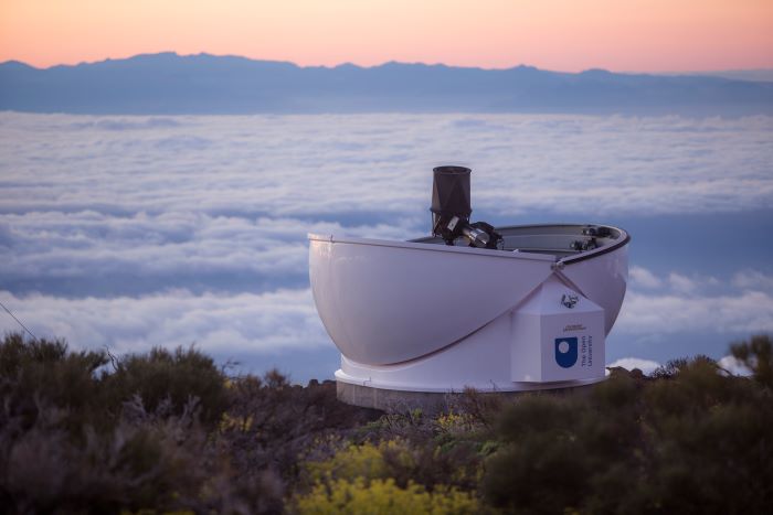 The PIRATE observatory, Observatorio del Teide. In the background the island of Gran Canaria can be seen rising above the cloud layer.