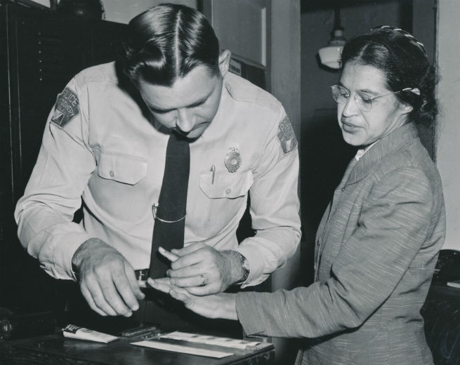 Rosa Parks being fingerprinted by Deputy Sheriff D.H. Lackey after being arrested for boycotting public transportation