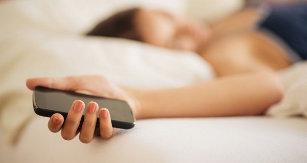 woman asleep with her smartphone