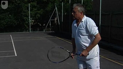 Jim Bowen playing tennis
