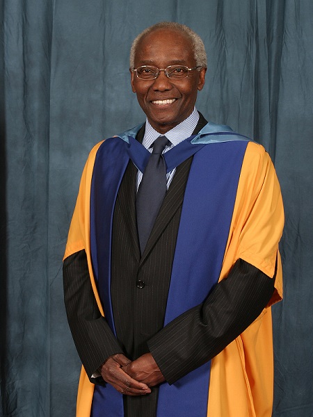 A photograph of Geoff Palmer wearing university robes