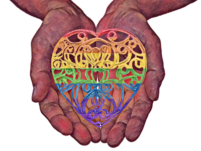 two hands, palms up, holding a lace heart in LGBTQ rainbow colours