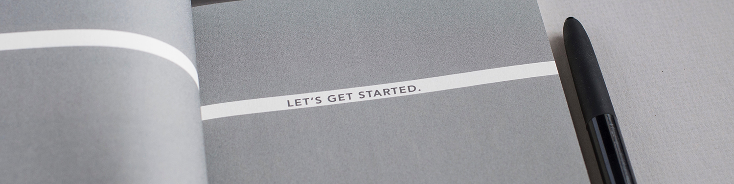 Turning a page that says 'Let's get started'.