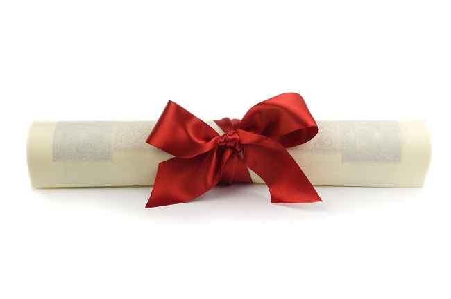 Diploma of University graduation with a red silk ribbon