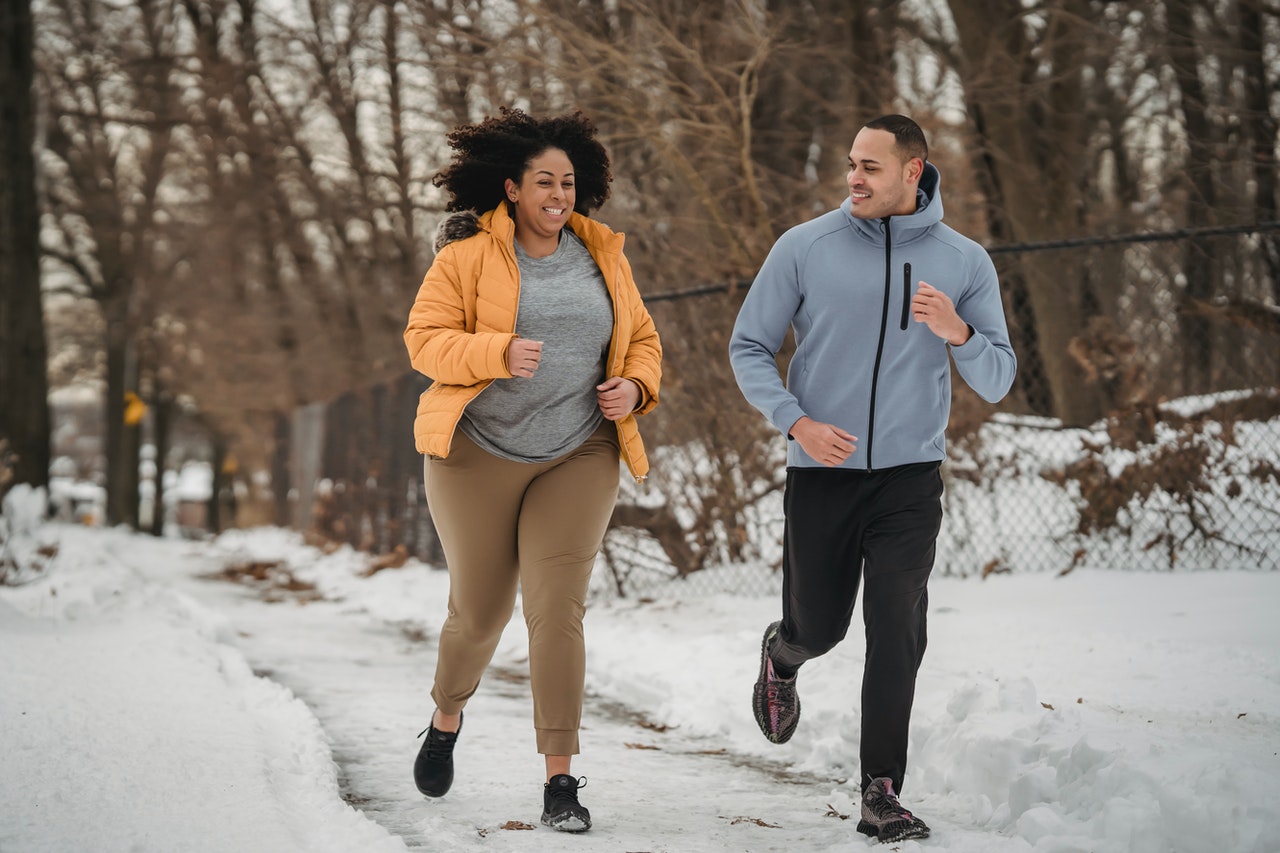 two people running in the park