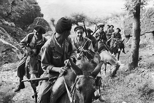 A black-and-white photograph of a number of soldiers on horseback.