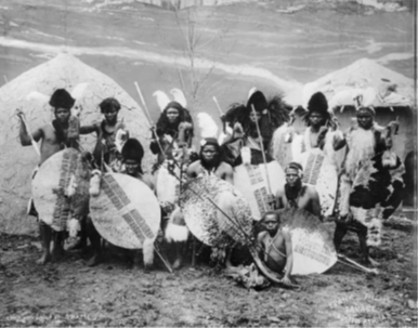 A black-and-white photograph of the performers from Savage South Africa.