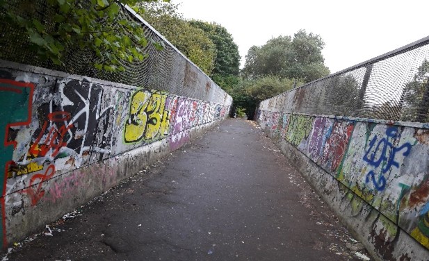 Graffiti on the railway bridge, Gower Street at Bellahouston Academy, Glasgow.