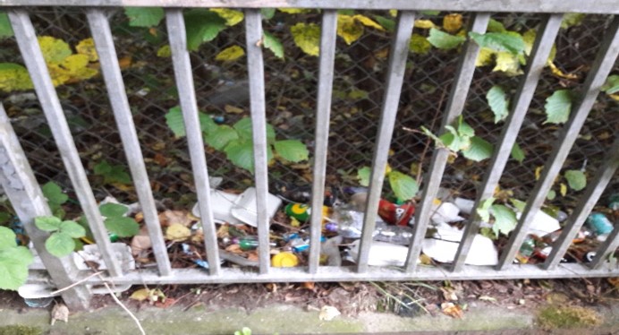 Litter piled up at the railings to the M8 at Clifford Street, Glasgow.