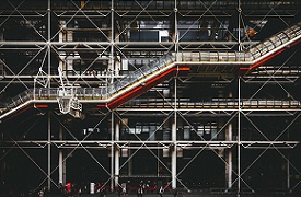 A building with its structural elements visible on the outside.