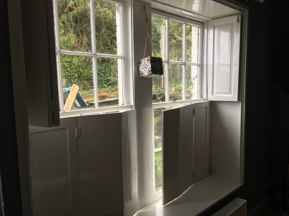 Photo of original shutters in a heritage building 