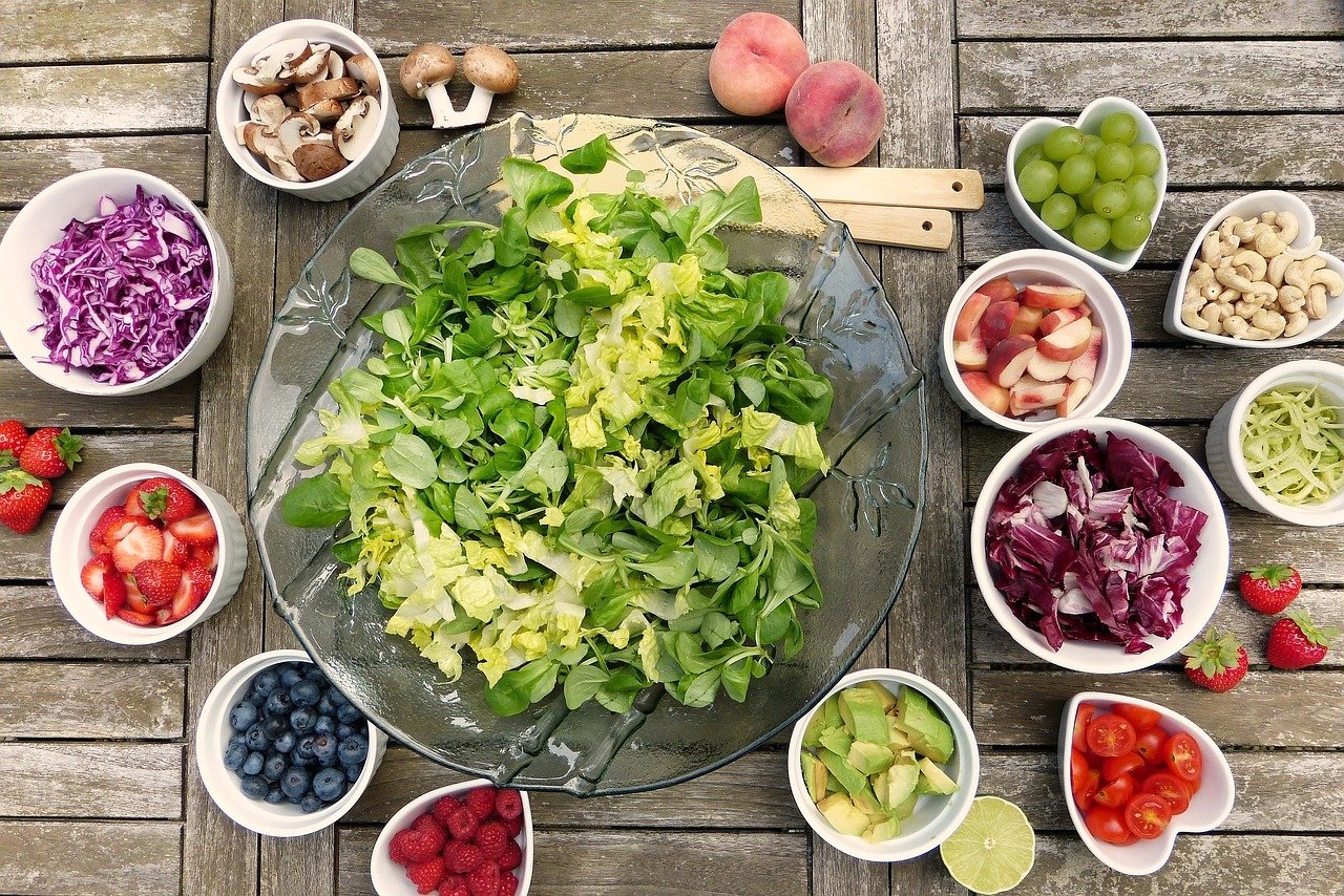 Photo - bird's eye view of various bowls containing vegetables and fruit