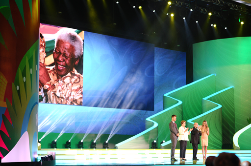 A photograph of a tribute to Nelson Mandela with a photo of him holding the world cup.