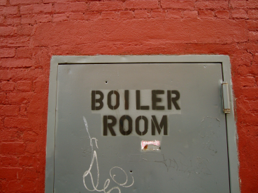 What is a boiler room scam, and how can I protect myself?