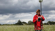 Flowery meadows and high tech surveying equipment