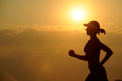 How can you exercise safely in the heat?
