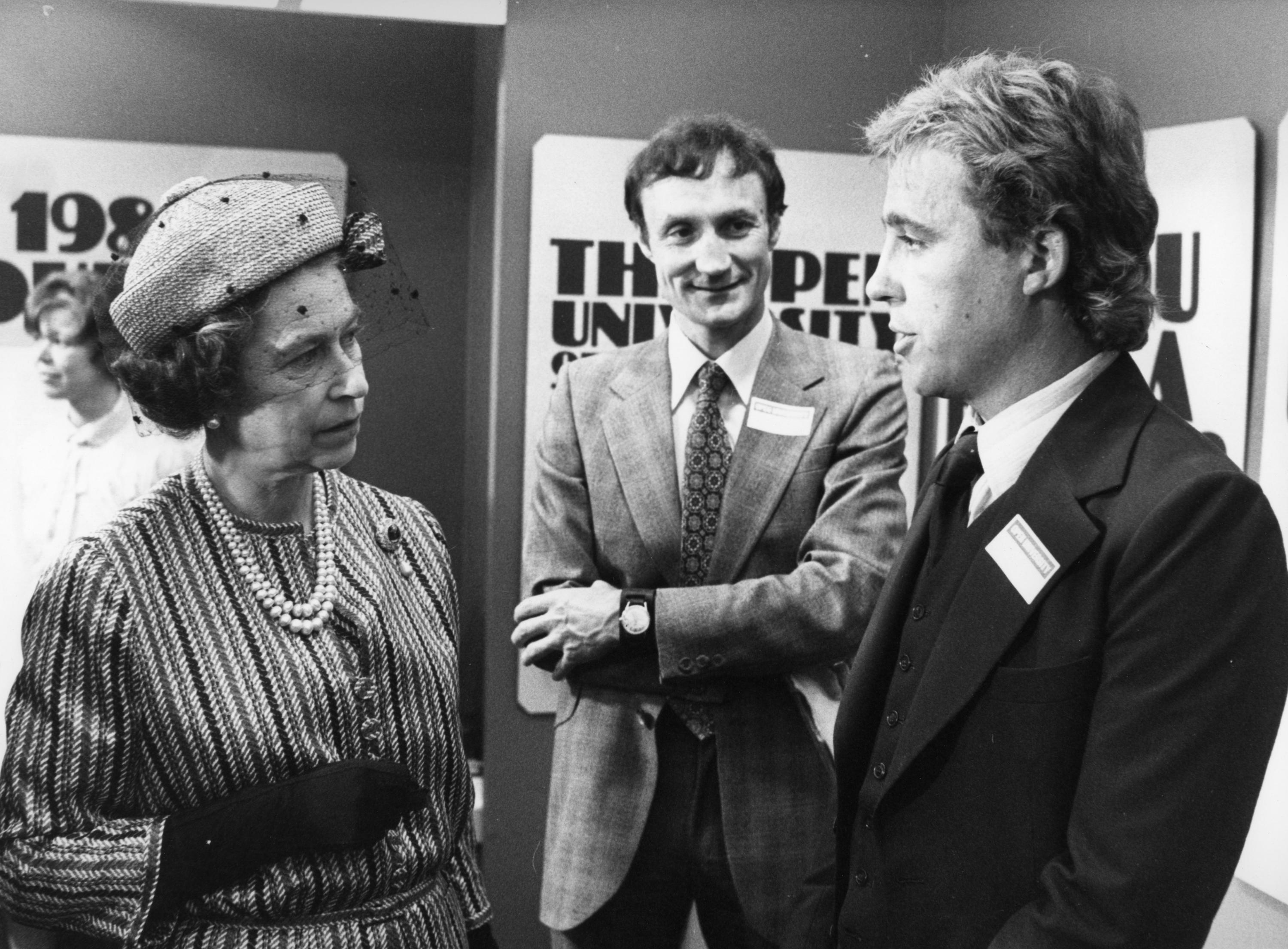 Queen Elizabeth II talks with undergraduate student Geoffrey Benton-Smith from Stony Stratford, Milton Keynes.