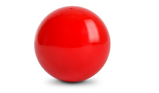 This is a photograph of a red sphere (most likely a snooker ball), which demonstrates positive curvature.