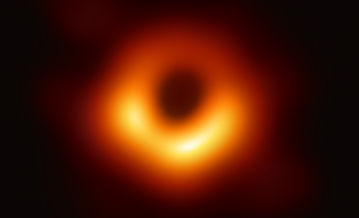 This is a photograph from the Event Horizon Telescope, showing a bright red/orange ring formed around a black hole.