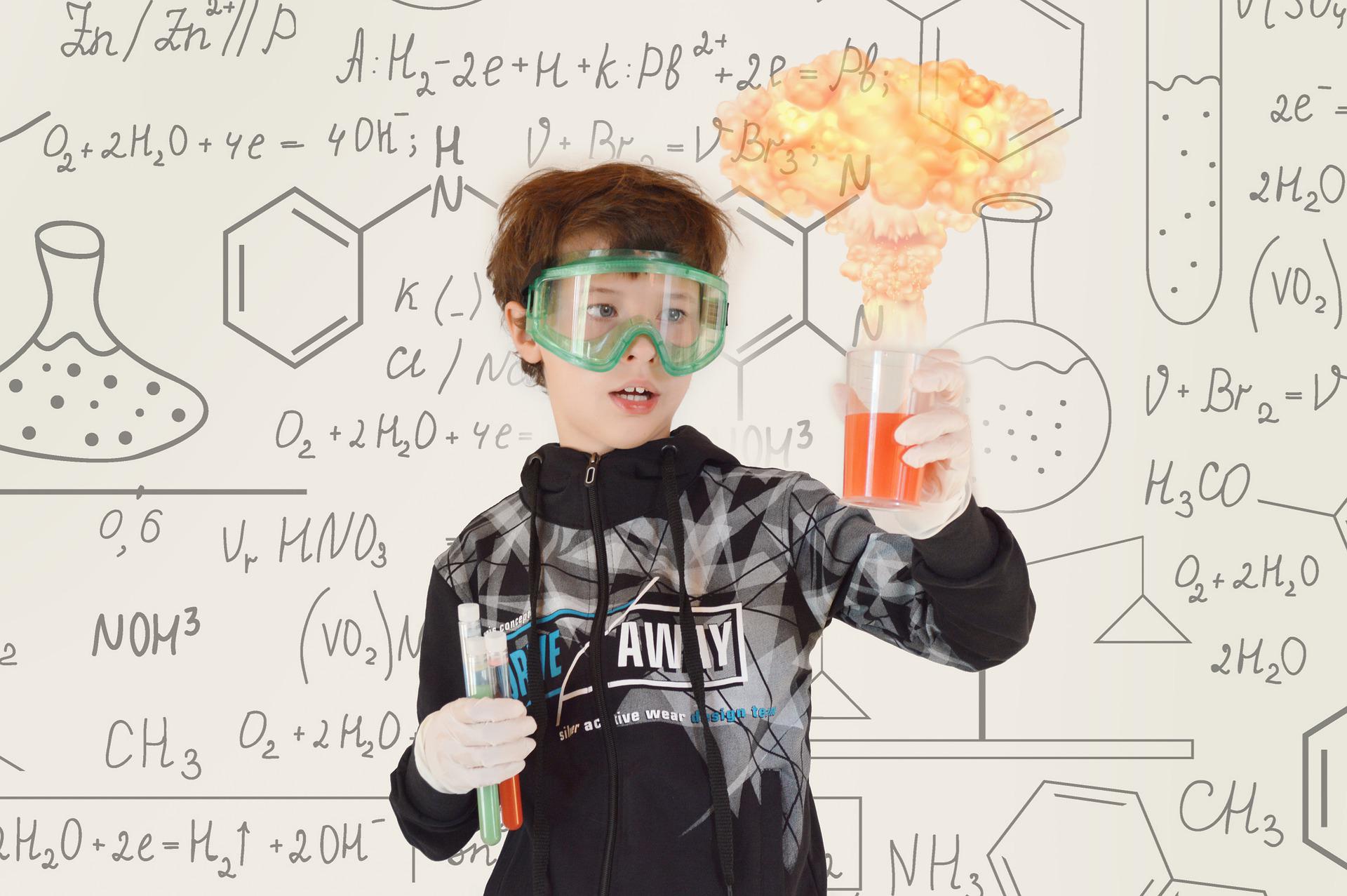Young boy doing a chemistry experiment. 