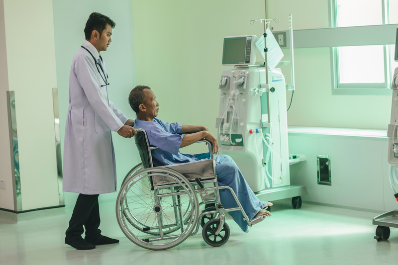 Patient in a wheelchair in the hospital with a doctor