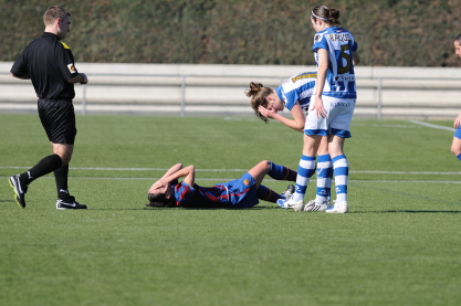 Why do female footballers experience knee injuries and what can be done?