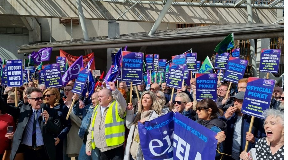 college lecturers protesting with banners outside Scottish parliament