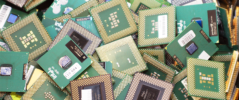 Pile of retired computer processors with gold plated pins