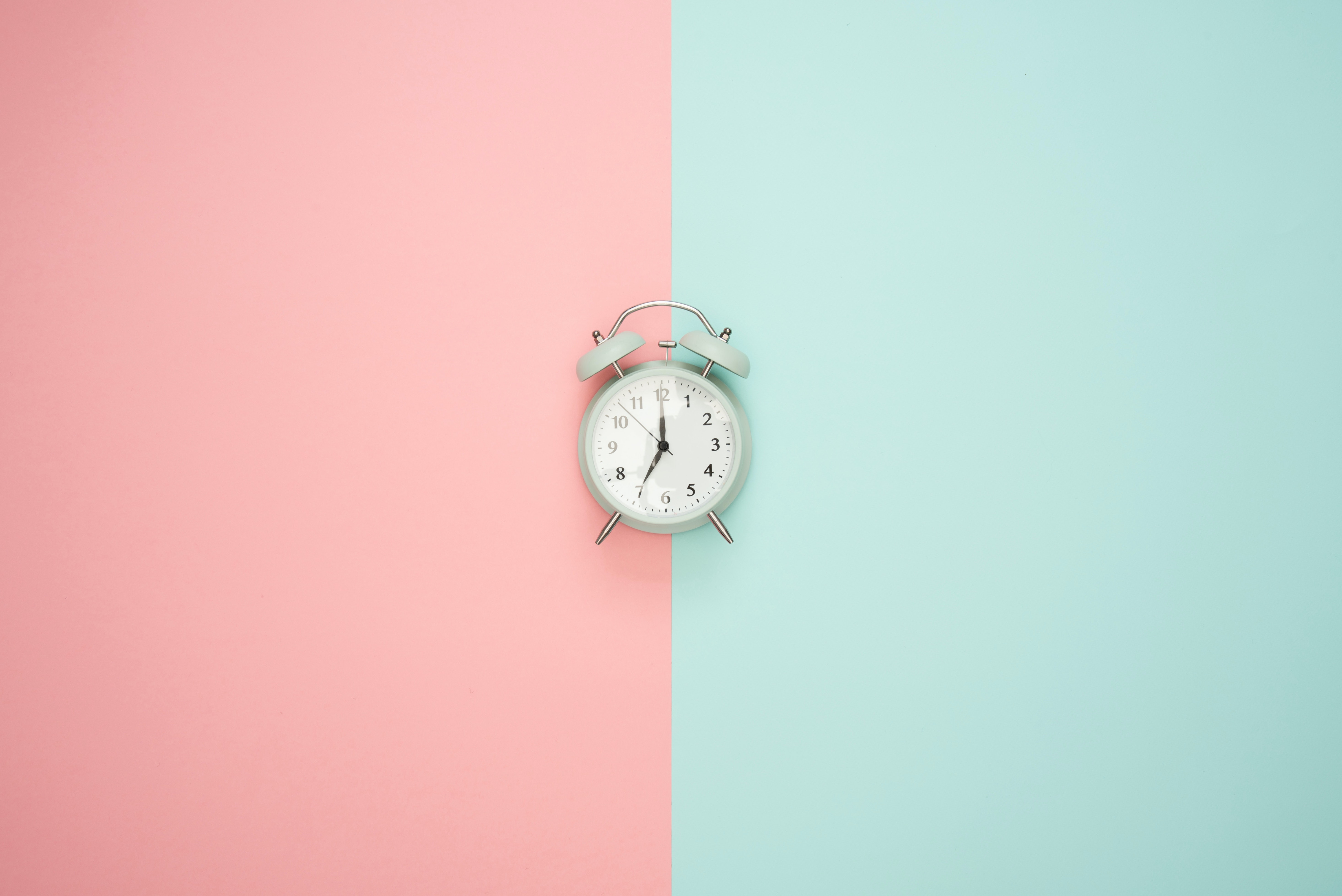 Clock on a pink and blue background
