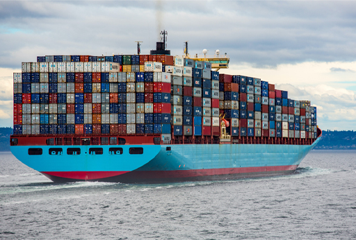 Photograph of a container ship on the water.