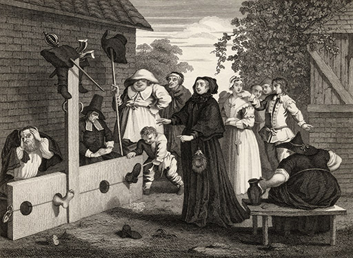 A black and white image showing two men in the stocks in a town square. Above the men hang their swords, boots and pistols. Other people, mostly women, gather around to witness the punishment. Some of the spectators seem amused, others curious.