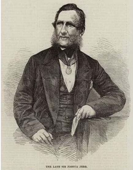 This is a half-length black and white portrait of a man with dark hair and full sideburns. He is formally dressed in jacket and waistcoat over a white shirtfront, and a medal hangs on a ribbon around his neck. His head is angled to the left and his gaze directed upwards.