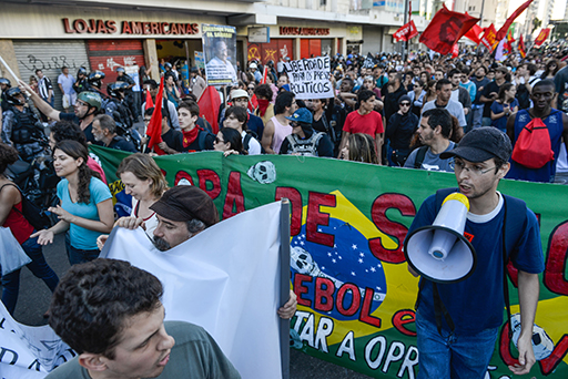 A photograph of a group of people in a protest.