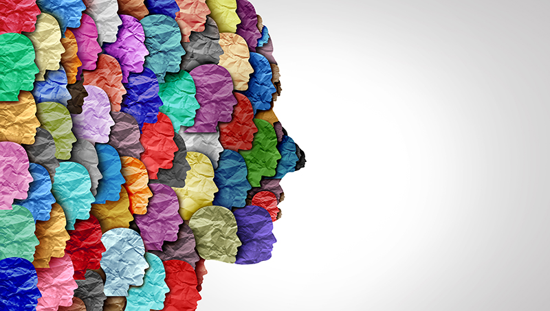 Graphic of a side profile of a face, made up of many smaller side profile faces.