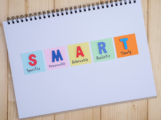 A photograph with a notepad and the SMART labels layed out.
