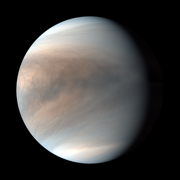 A false colour image of the thick cloud cover over Venus. The clouds are patterns of greys, browns and pale oranges.