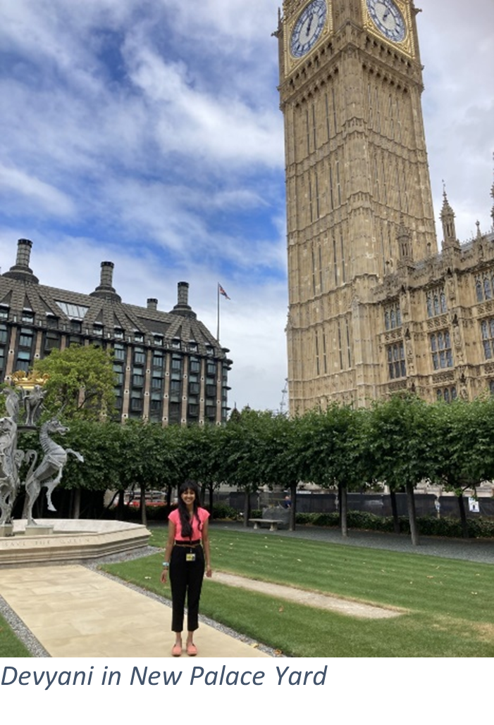 Devyani, standing by the Jubilee Fountain in New Palace Yard, to the north-west of the Houses of Parliament. Big Ben behind.