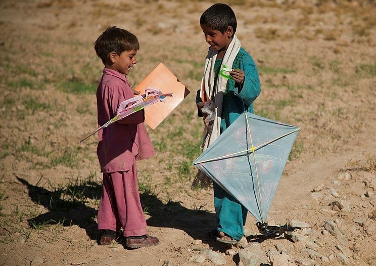  Two young Afghan boys playing with kites 