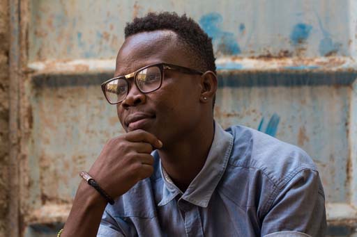 A person with their hand on their chin, looking intently.