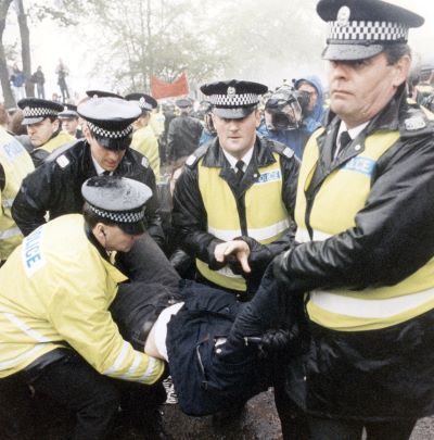 Police fighting with protestor on picket line